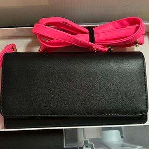 Black crossbody or clutch with hot pink straps.